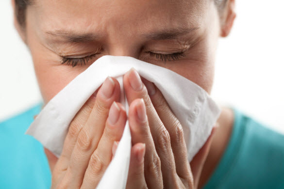 Woman sneezing