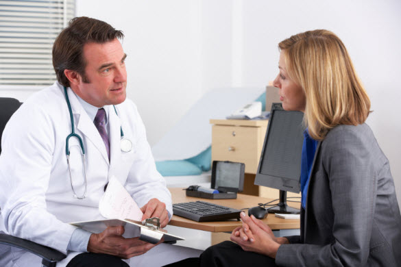 Woman talking to doctor