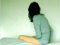 woman on bed looking away