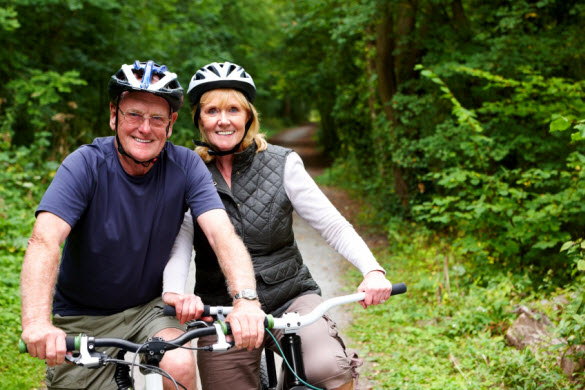 Middle age couple biking