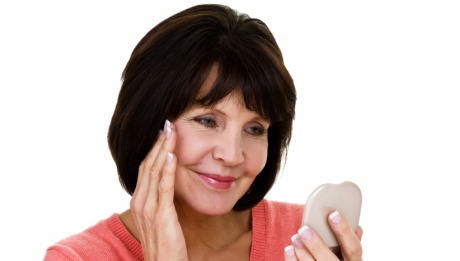 Image: Women Looking at Face in Mirror