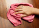 hand with damp cloth